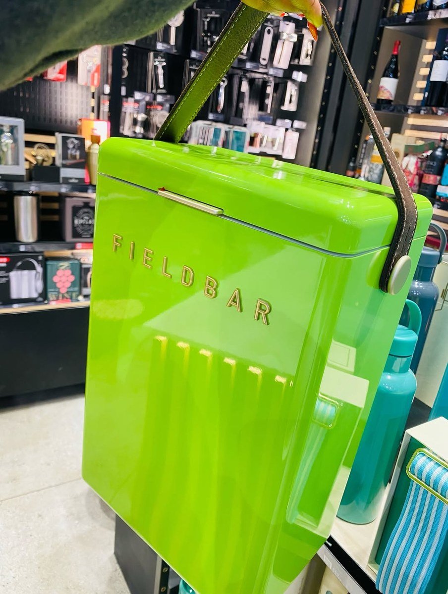 Fieldbar 10L Drinks Box in Limited Edition Match Point Green carried by its leather handle